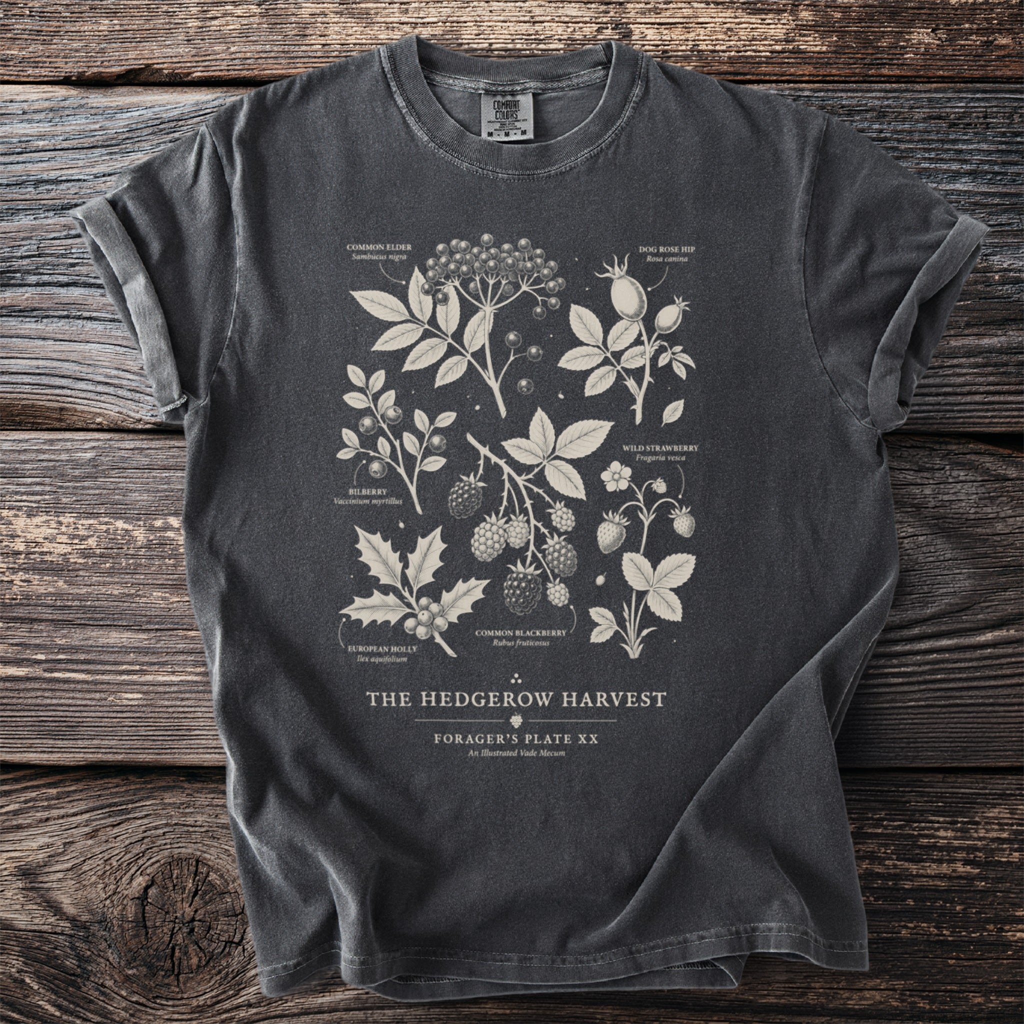 Dark grey t-shirt with illustrated plants and text: "The Hedgerow Harvest".