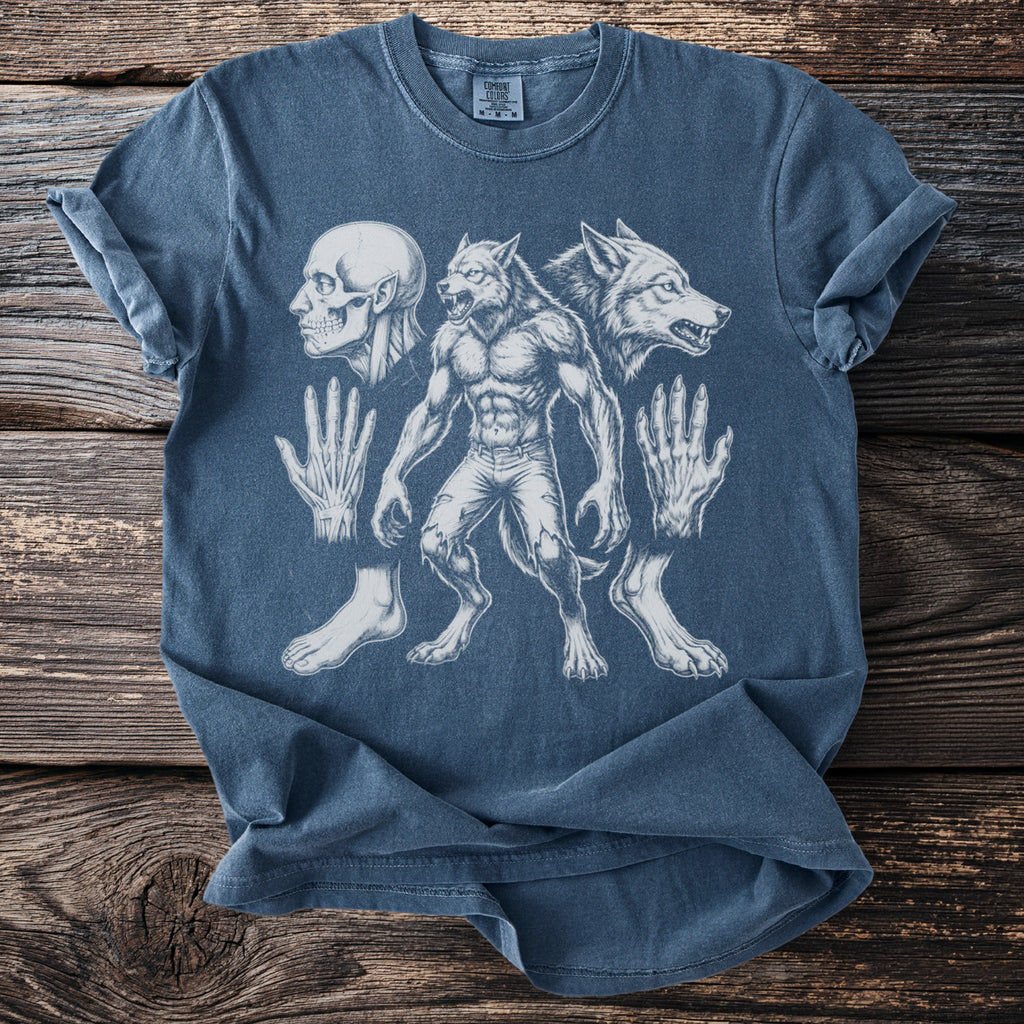 Blue t-shirt with drawing of a werewolf, wolf head, skull, hands, and feet.