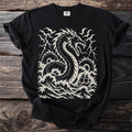Black t-shirt with cream print of a sea serpent attacking a sailing ship in stormy seas.