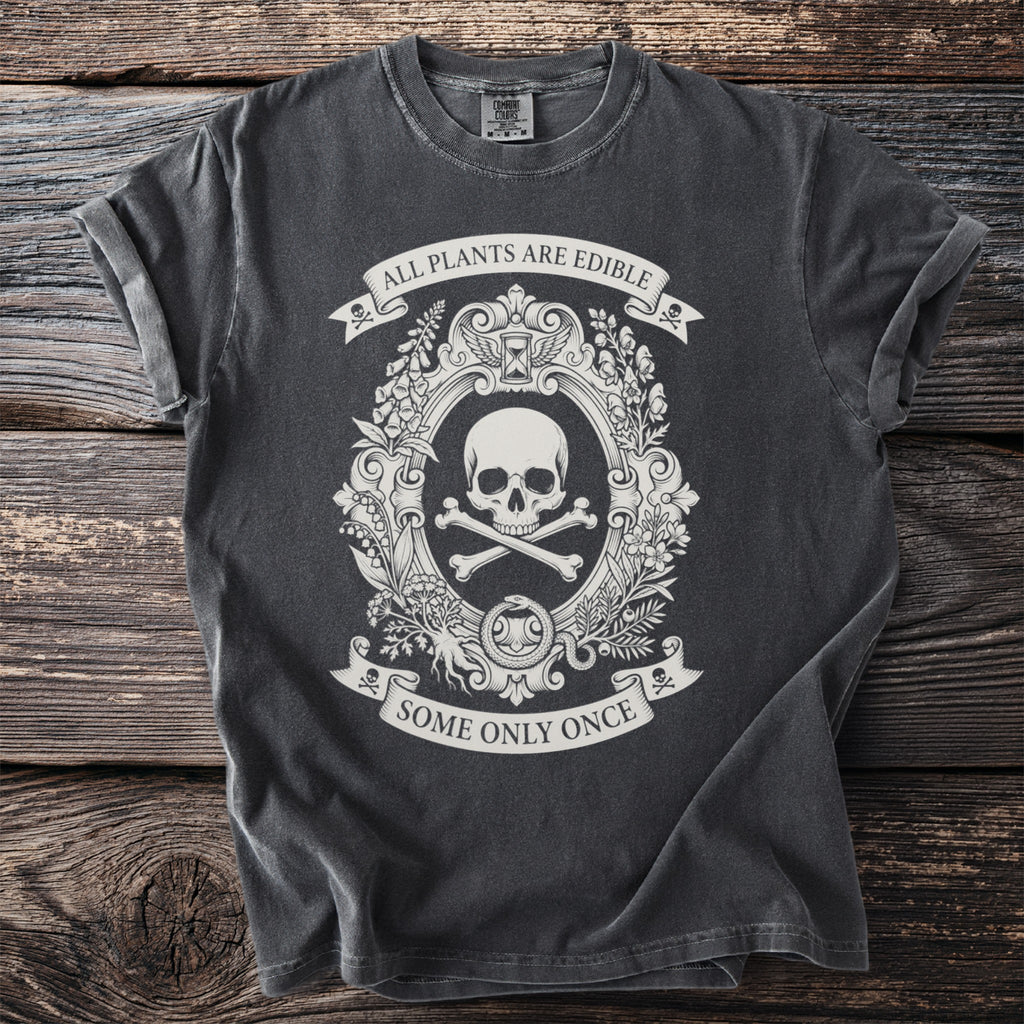 Dark t-shirt with skull and crossbones, nature illustrations, and text.
