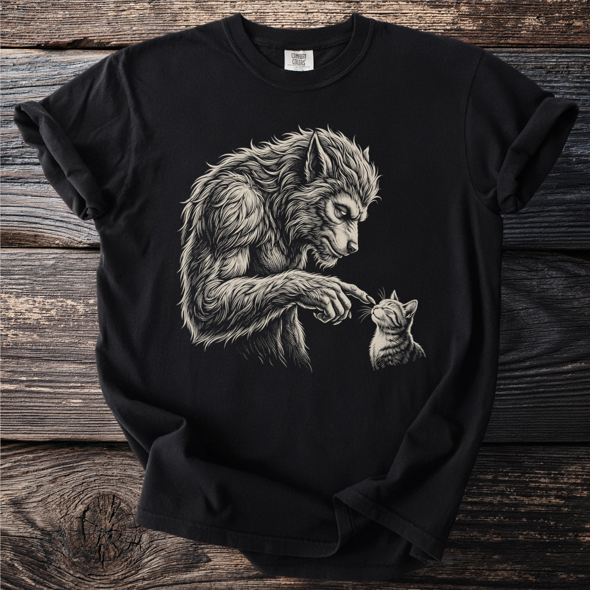 Werewolf gently touches a kitten's nose on a black t-shirt.