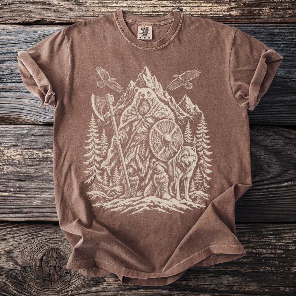Brown t-shirt with white graphic of a warrior bear, wolf, eagles, axe, and shield.