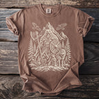 Brown t-shirt with white graphic of a warrior bear, wolf, eagles, axe, and shield.