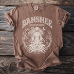 Brown t-shirt with white text and graphic of a Banshee in Irish Celtic folklore.