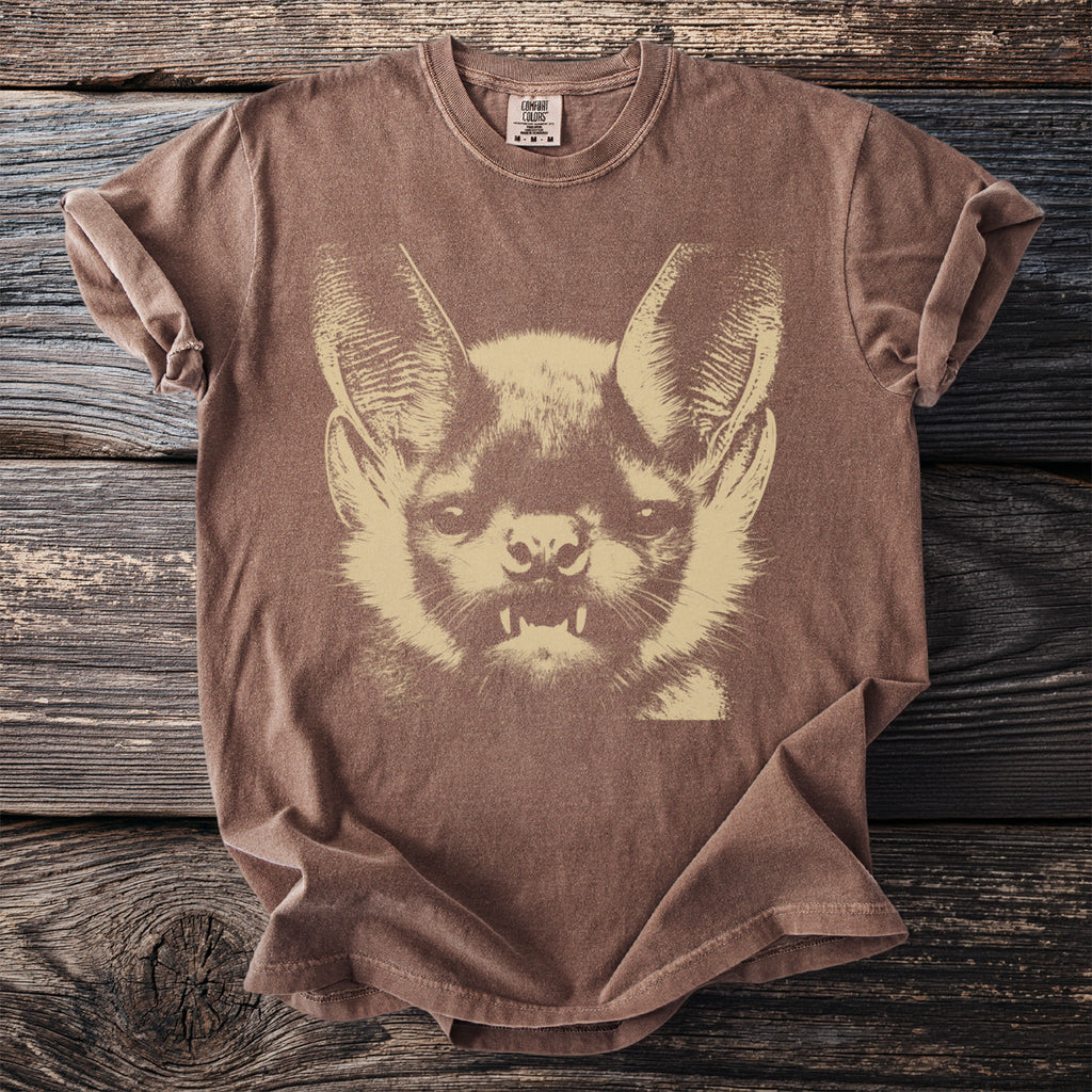 Brown t-shirt with a light brown graphic of a bat's face.