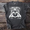 T-shirt with a black and white illustration of a woman with a flower crown and heart hands.