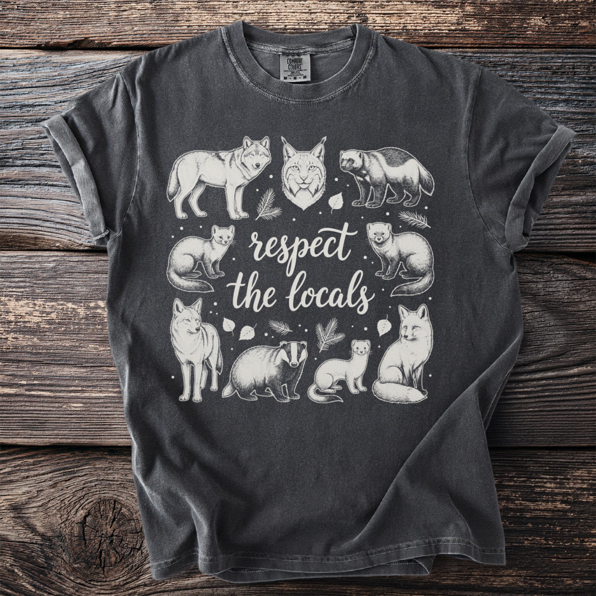 Charcoal t-shirt with illustrations of woodland animals and text "respect the locals".