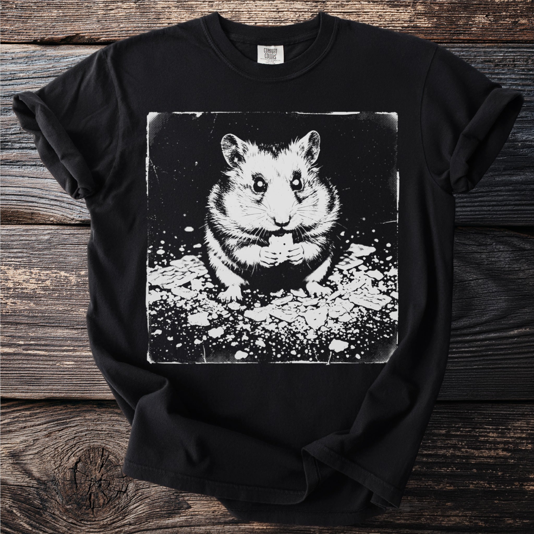 Black t-shirt with a white ink stylized drawing of a hamster eating food.