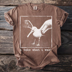 Brown t-shirt with distressed graphic of a seagull titled "i take what i want."
