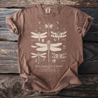 Brown t-shirt with beige dragonfly illustrations and text "The Dragonfly Pond".