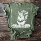Green Comfort Colors t-shirt with a distressed white graphic of a squirrel holding a cup.