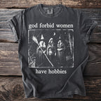 T-shirt with a graphic of three witches and the text "God forbid women have hobbies."