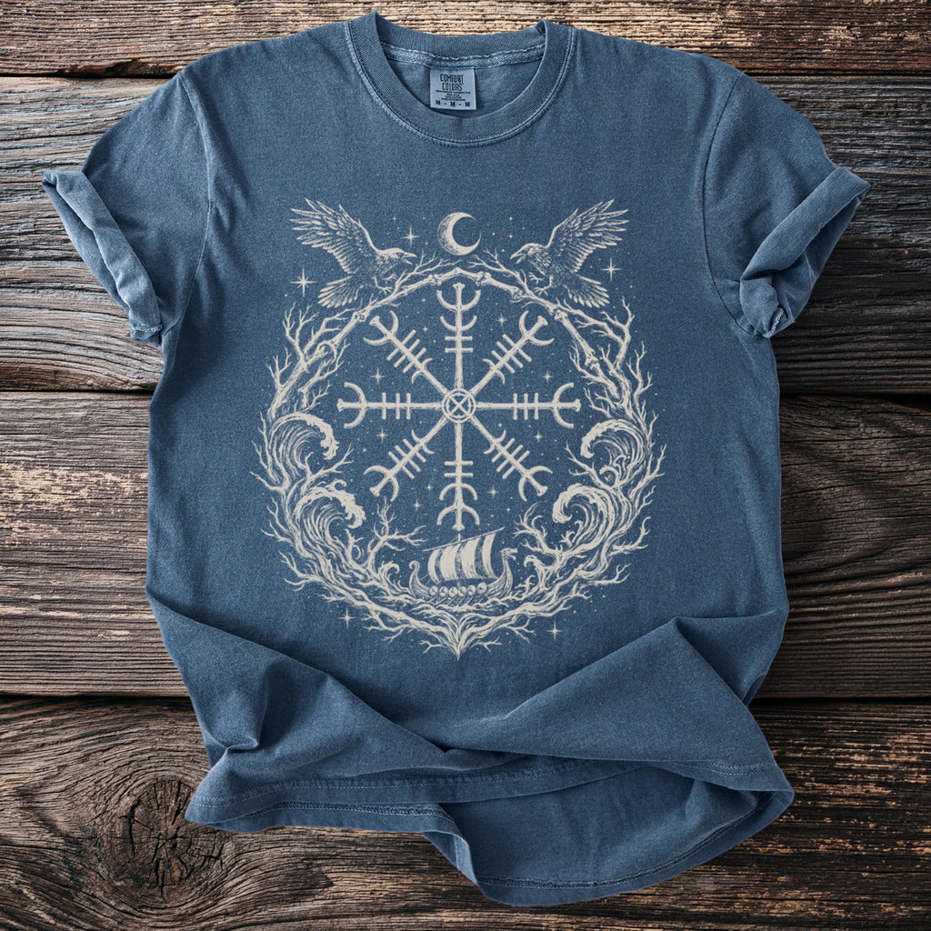 Blue t-shirt with a light-colored circular Norse-inspired print featuring a ship.