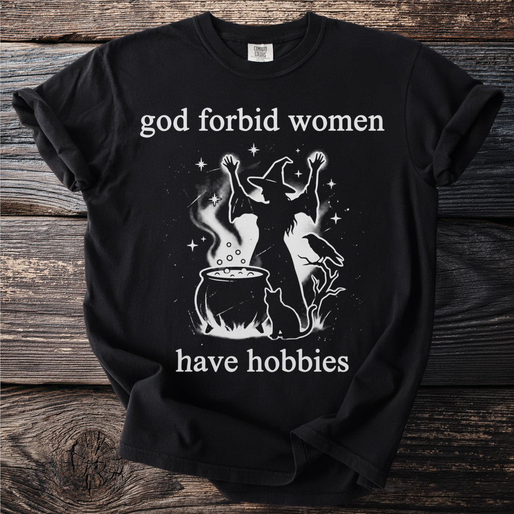 Black t-shirt with "God forbid women have hobbies" and witch graphic.