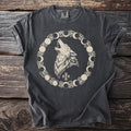 Dark gray t-shirt with a howling wolf surrounded by moon phases and thorns design.
