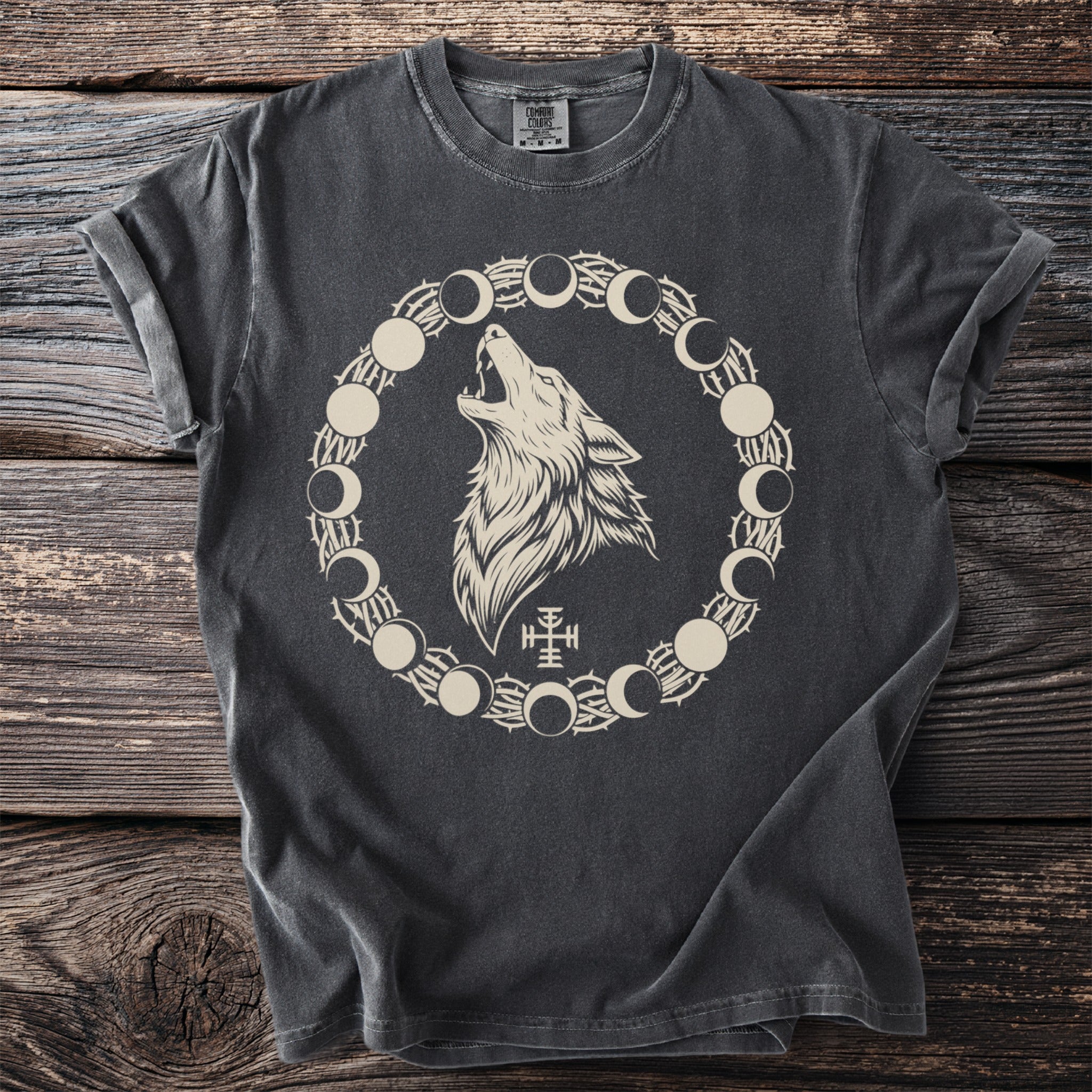 Dark gray t-shirt with a howling wolf surrounded by moon phases and thorns design.