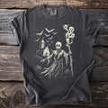 Dark grey t-shirt with a cream graphic of a grim reaper, church, and bats.