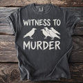 Dark grey t-shirt with white text "WITNESS TO MURDER" and a murder of crows graphic.