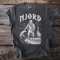 T-shirt with white graphic of "NJORD" and a Viking man by a boat and rough seas.