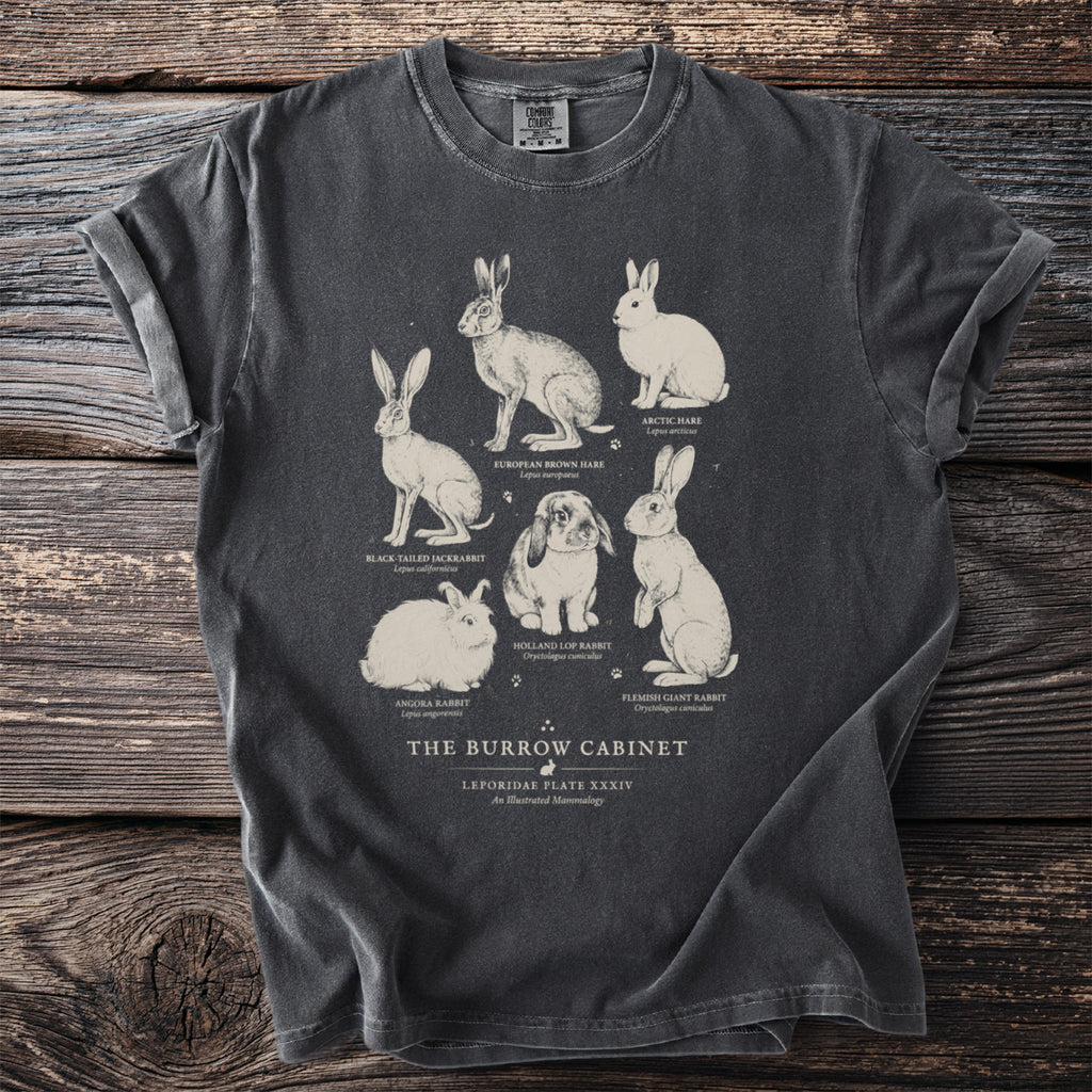 T-shirt featuring an illustration of six rabbit and hare species titled "The Burrow Cabinet."