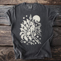 Dark t-shirt with white print of a nine-tailed fox, moon, and torii gate.
