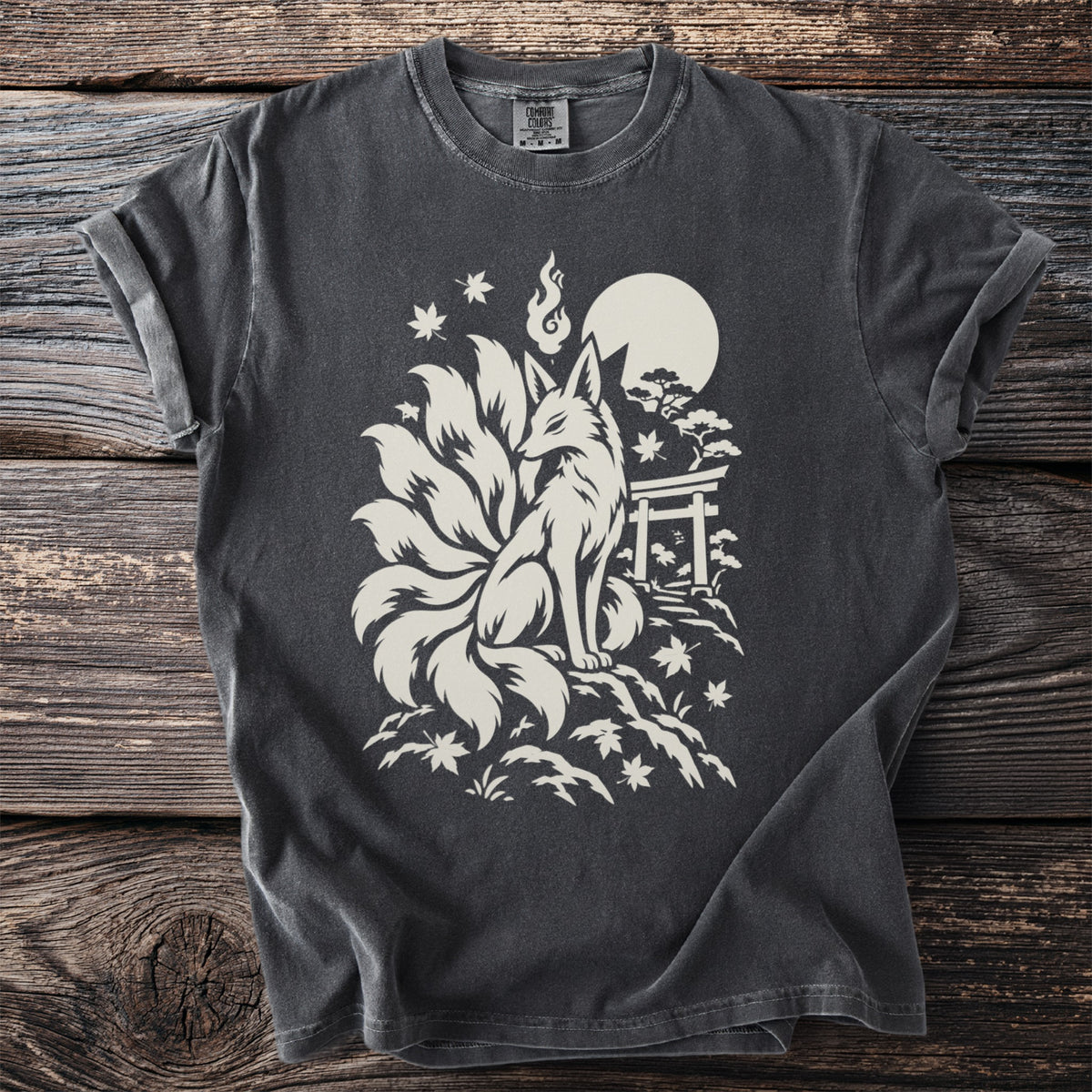 Dark t-shirt with white print of a nine-tailed fox, moon, and torii gate.