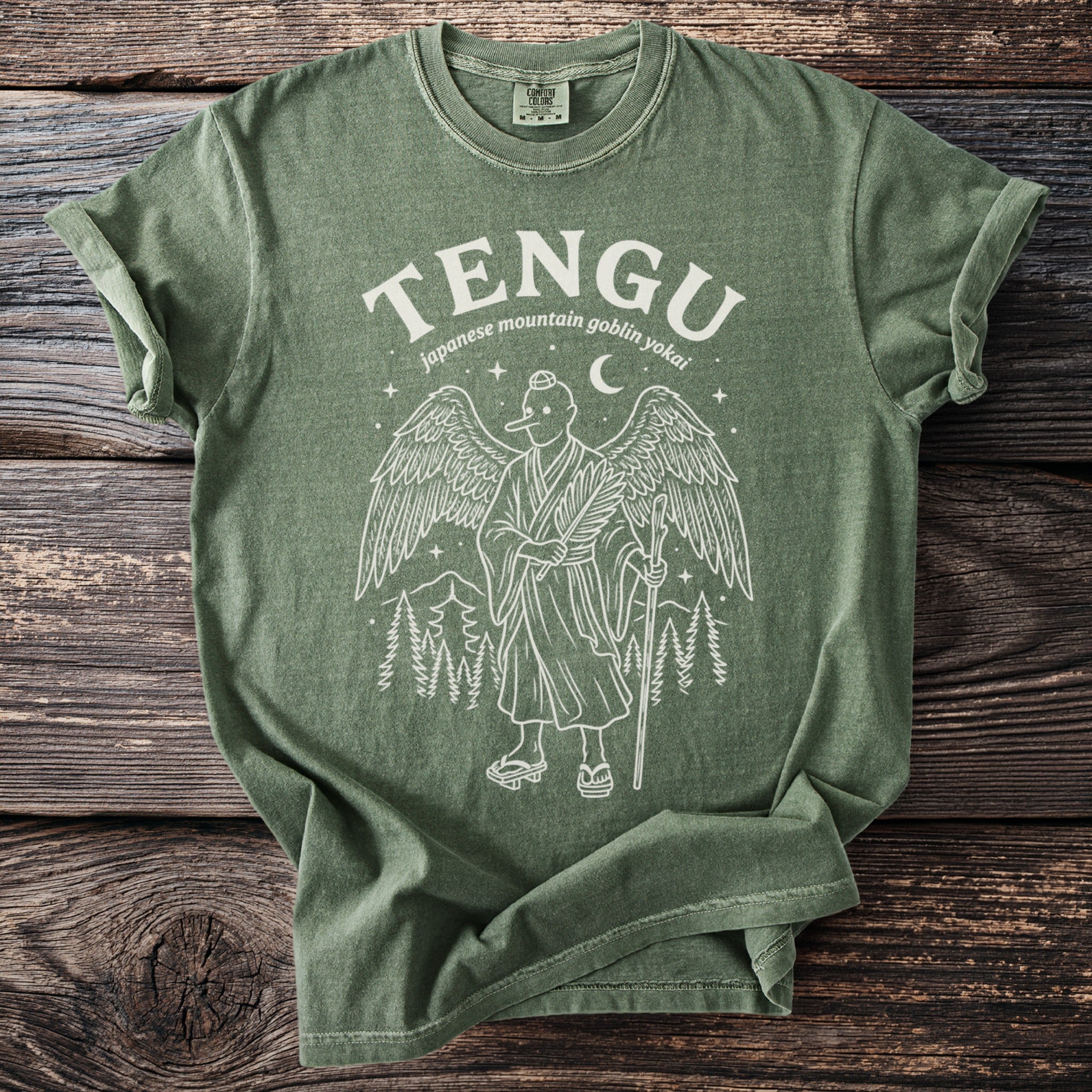 Green t-shirt with Tengu illustration and text "japanese mountain goblin yokai"