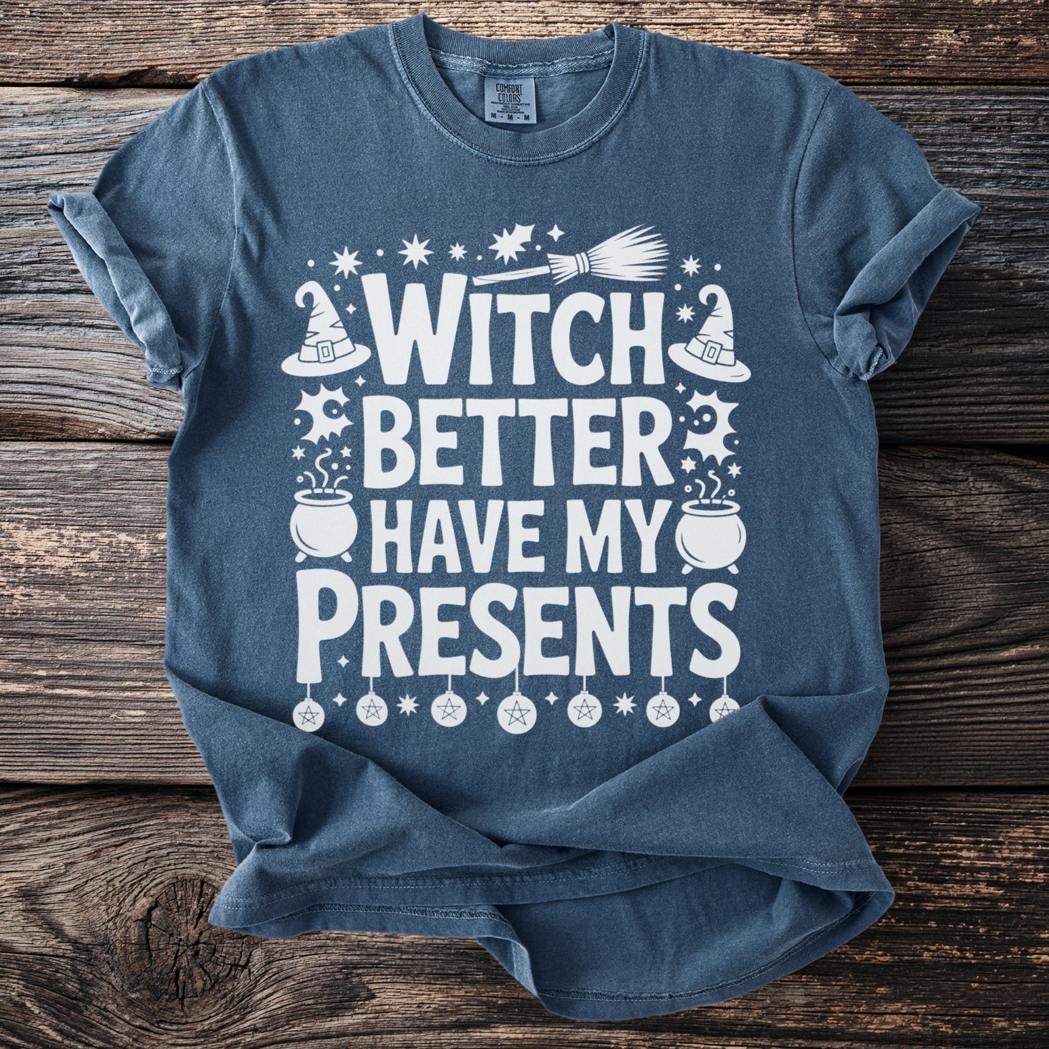Blue t-shirt with white text reading "WITCH BETTER HAVE MY PRESENTS" and Halloween graphics.