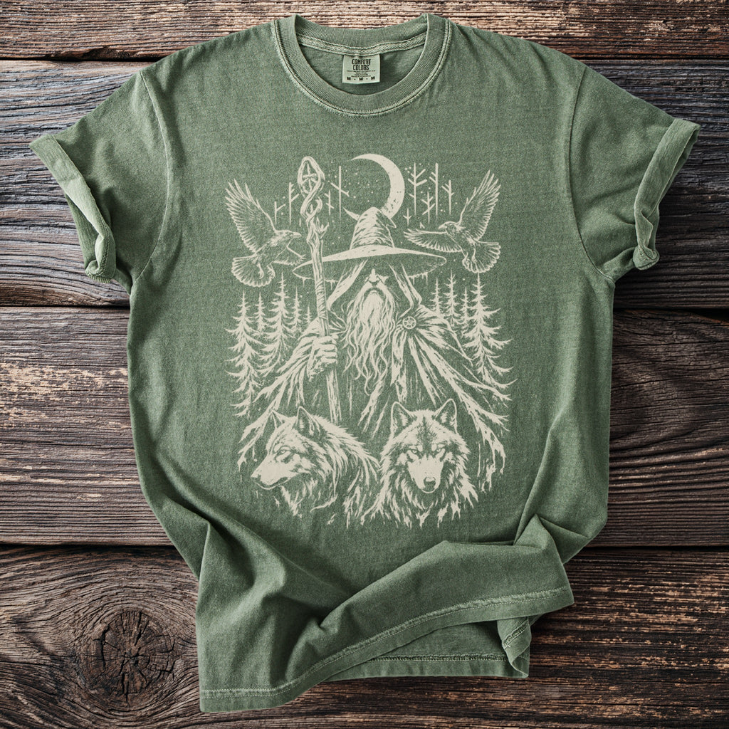 Green t-shirt with wizard, wolves, eagles, moon, and trees graphic.