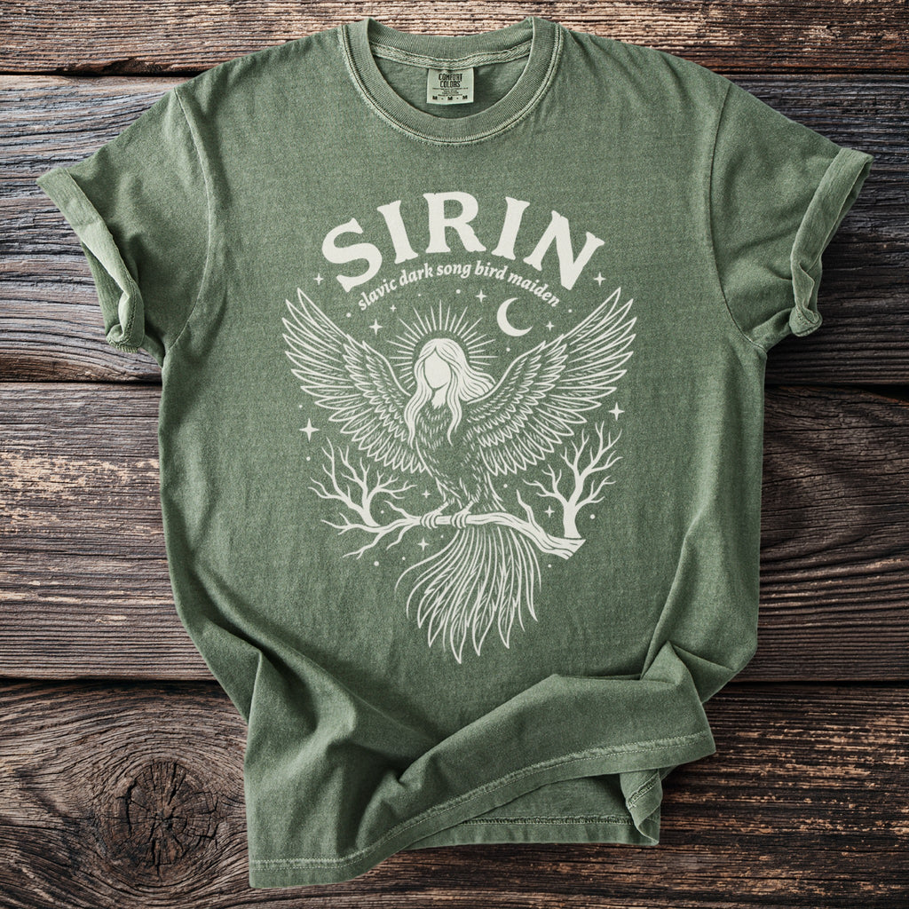 Green t-shirt with white graphic featuring a bird-woman and text "SIRIN Slavic dark song bird maiden".