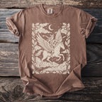 Brown t-shirt with a cream graphic of a winged woman riding a pegasus.