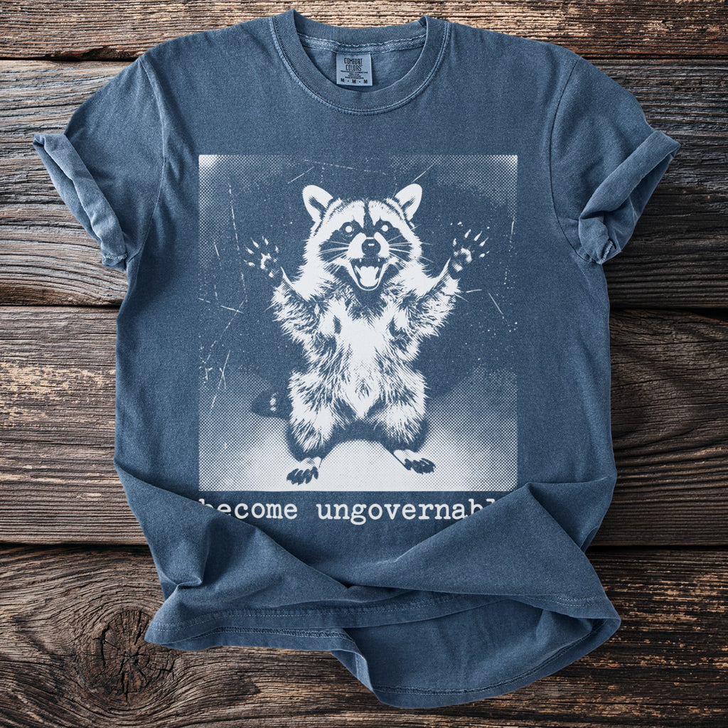 T-shirt with a distressed white print of a raccoon and text "become ungovernable".