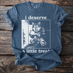 Blue t-shirt with wolf at refrigerator holding cake, text "i deserve a little treat".
