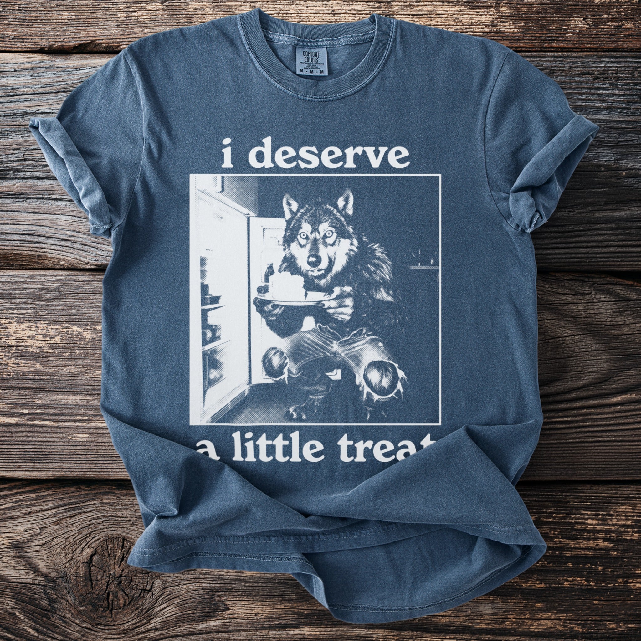 Blue t-shirt with wolf at refrigerator holding cake, text "i deserve a little treat".
