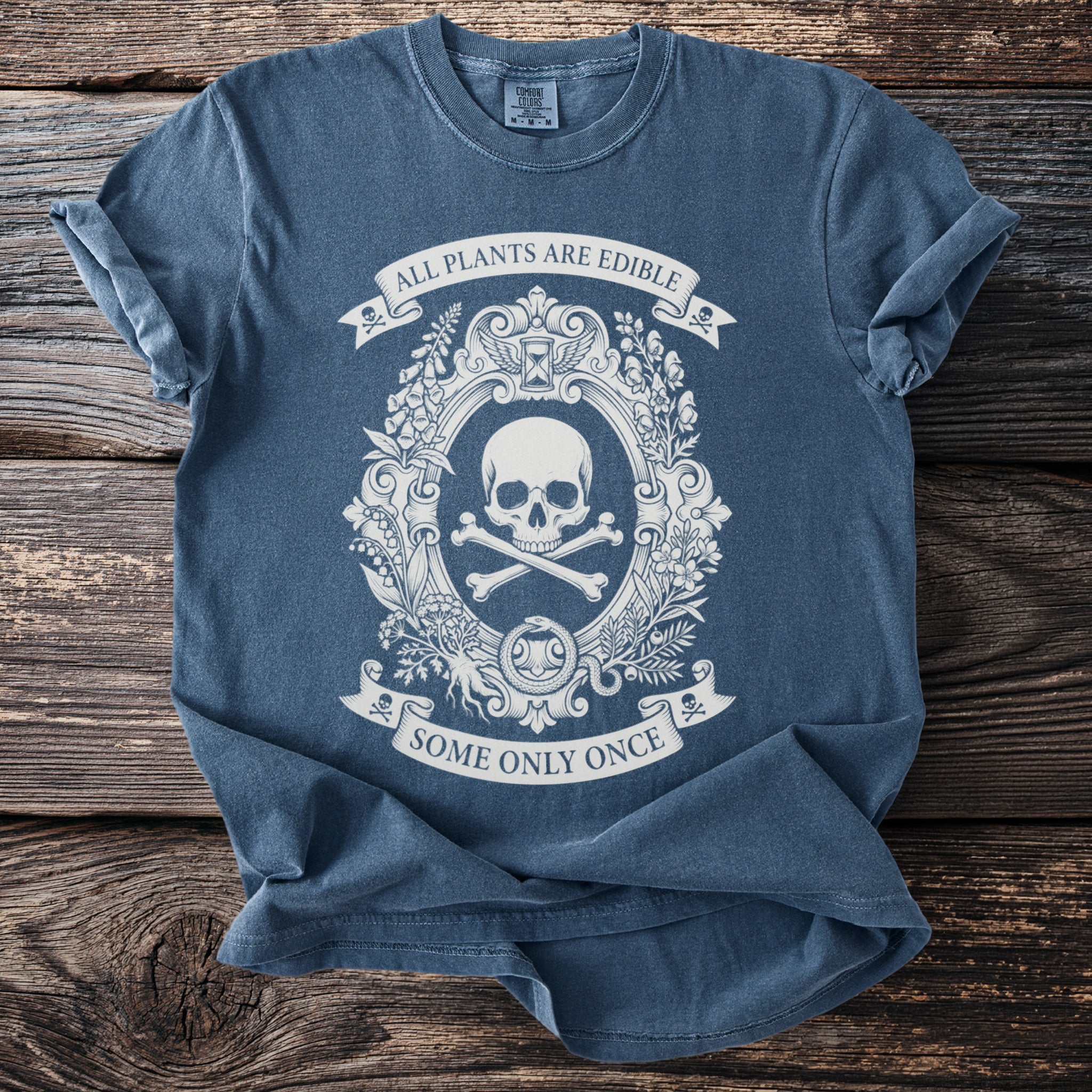 Dark blue t-shirt with a white graphic of a skull and crossbones and text.
