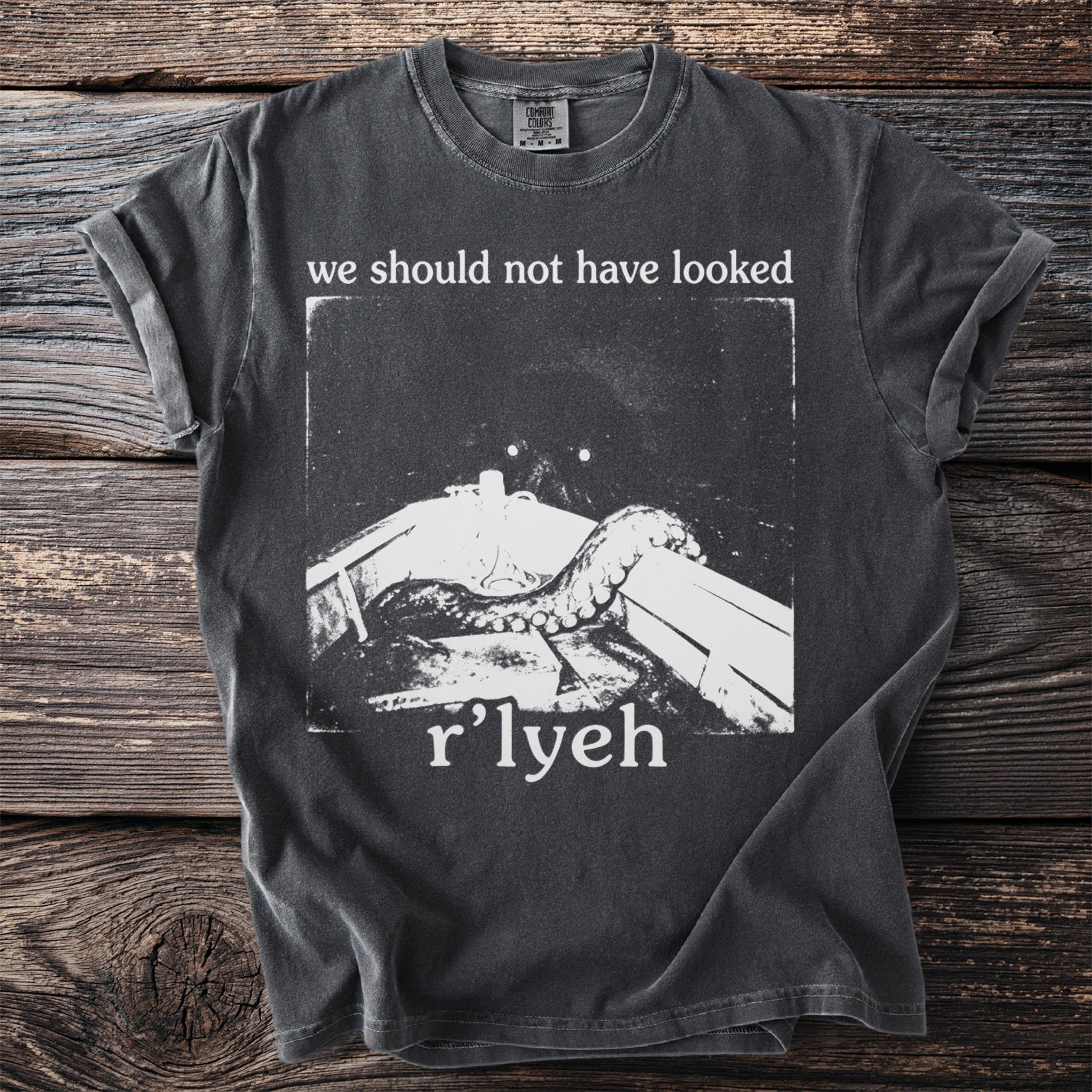 Dark t-shirt with "we should not have looked" and "r'lyeh" text and a tentacle graphic.