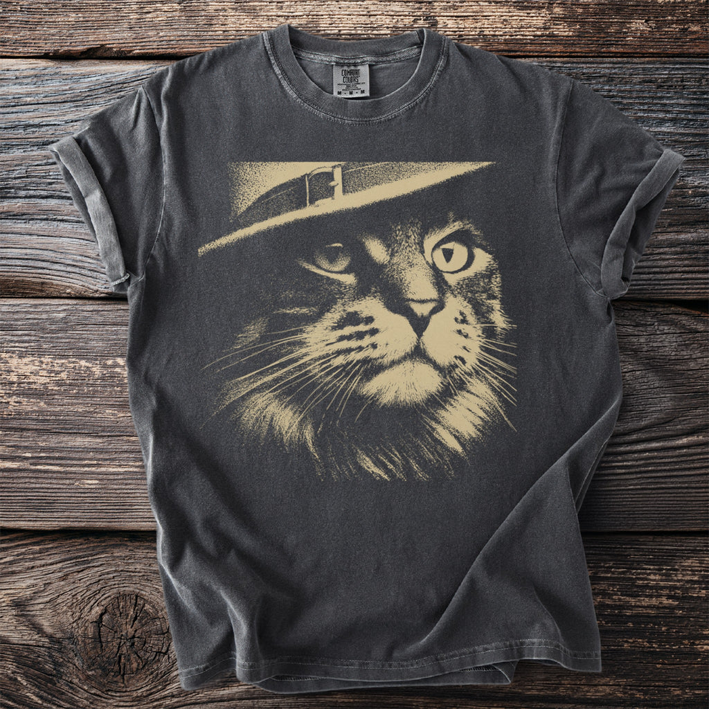Dark t-shirt with beige graphic of a cat wearing a fedora.