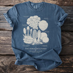 Blue t-shirt featuring an illustration of various fungi labeled "The Forager's Fungi".