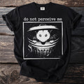 Black t-shirt with a white graphic of an opossum in a trash can reading "do not perceive me."