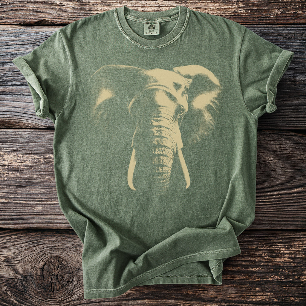 Green t-shirt with a faded graphic of an elephant's head and tusks.