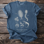 T-shirt with "The Living Light" bioluminescence illustration of sea creatures.