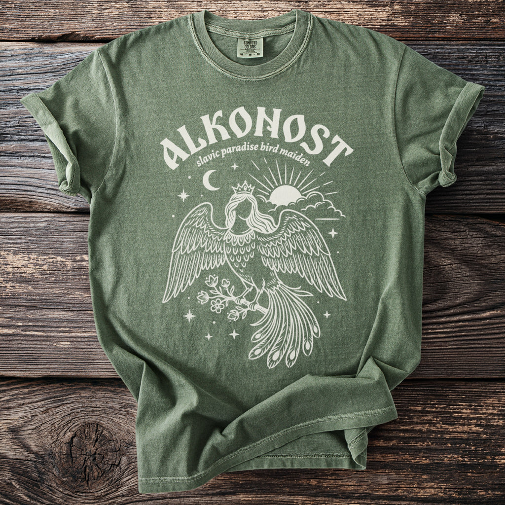 Alkonost Slavic paradise bird maiden graphic tee on green shirt.