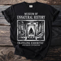 Black t-shirt with "Museum of Unnatural History" text and cabinet display.