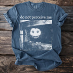 Blue T shirt with a bushbaby peering through wooden planks and “do not perceive me” text.