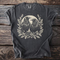 Dark grey t-shirt with two crows surrounded by foliage and berries.