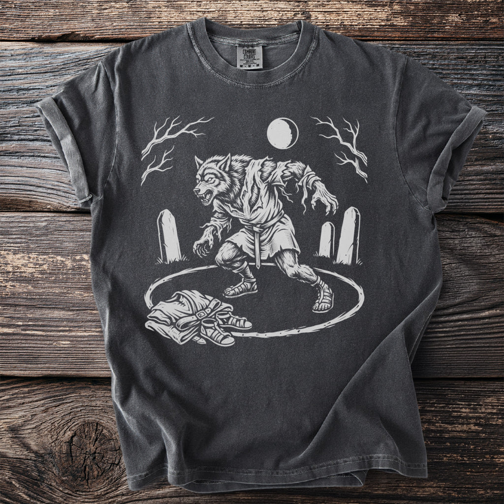 Werewolf graphic t-shirt with tombstones, moon, and discarded clothing.