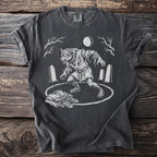 Werewolf graphic t-shirt with tombstones, moon, and discarded clothing.