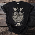 Black t-shirt with a central, intricate Norse symbol in beige, featuring ravens, a moon, and a Viking ship.