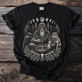 Black t-shirt print of a bearded man with a raven and wolf by a moon phase forest.