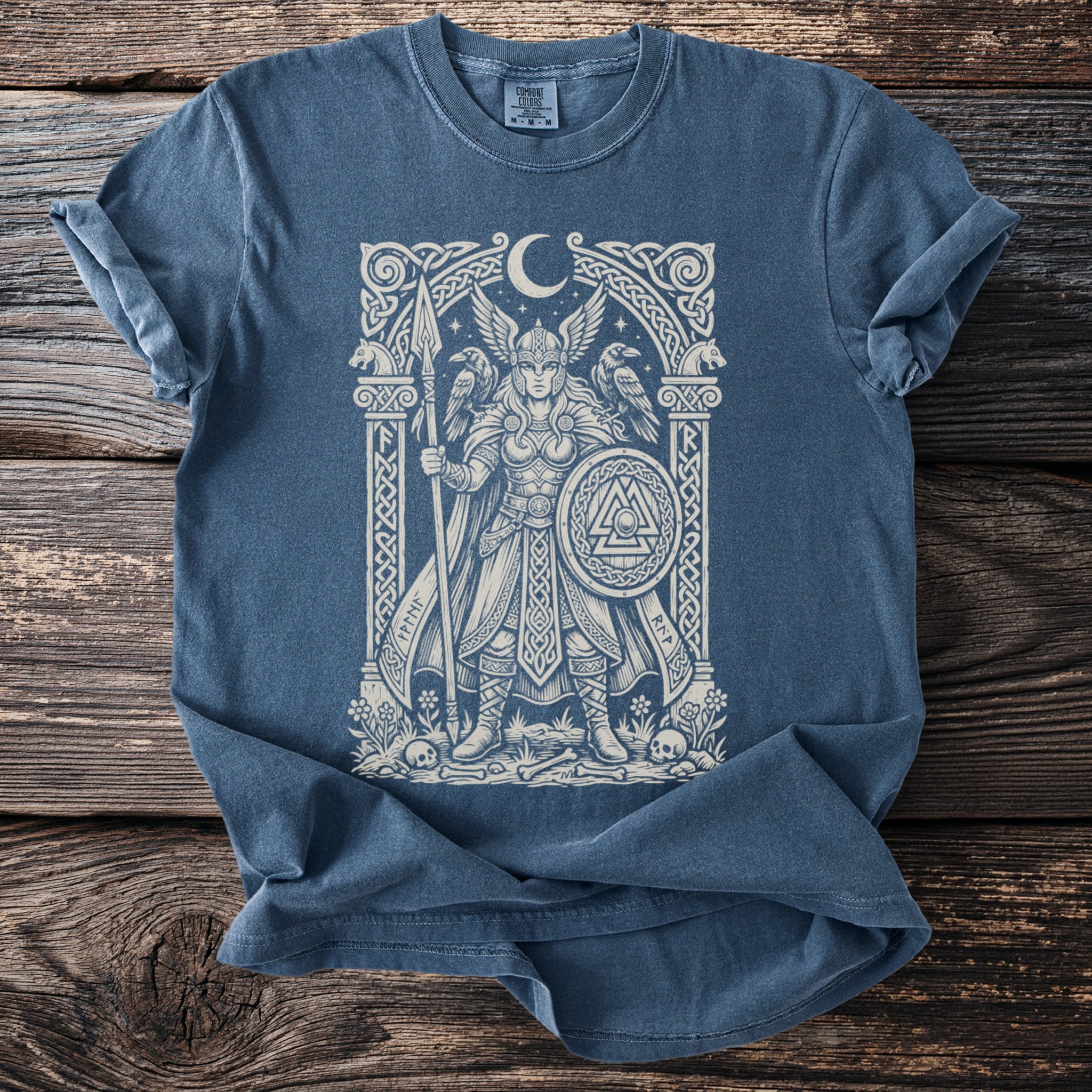 Blue t-shirt with a Viking design featuring a winged warrior, ravens, and runes.
